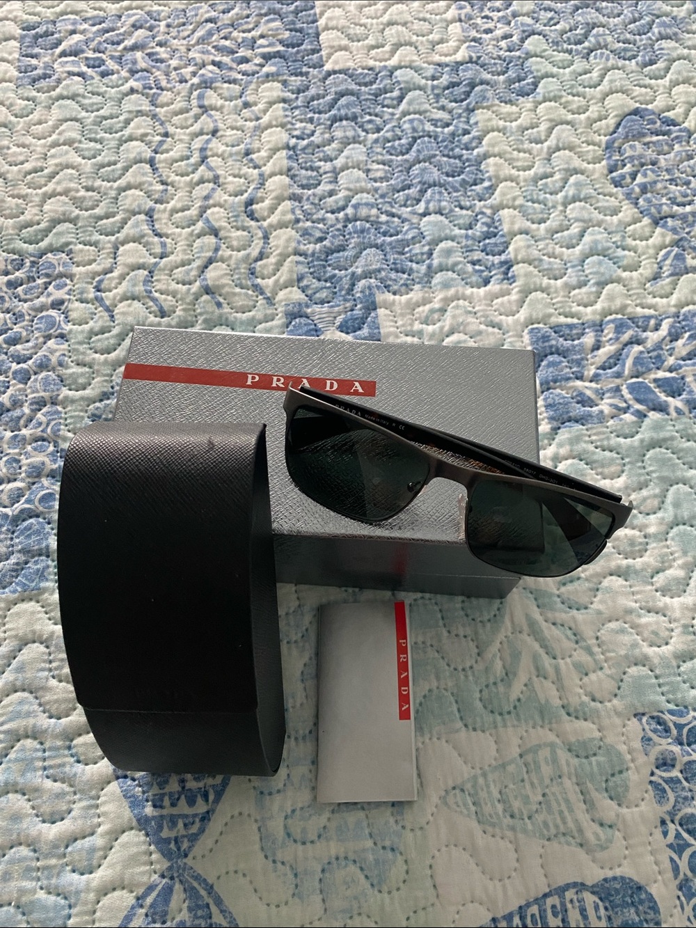 Prada Black Frame Sunglasses with Dark Green Lenses